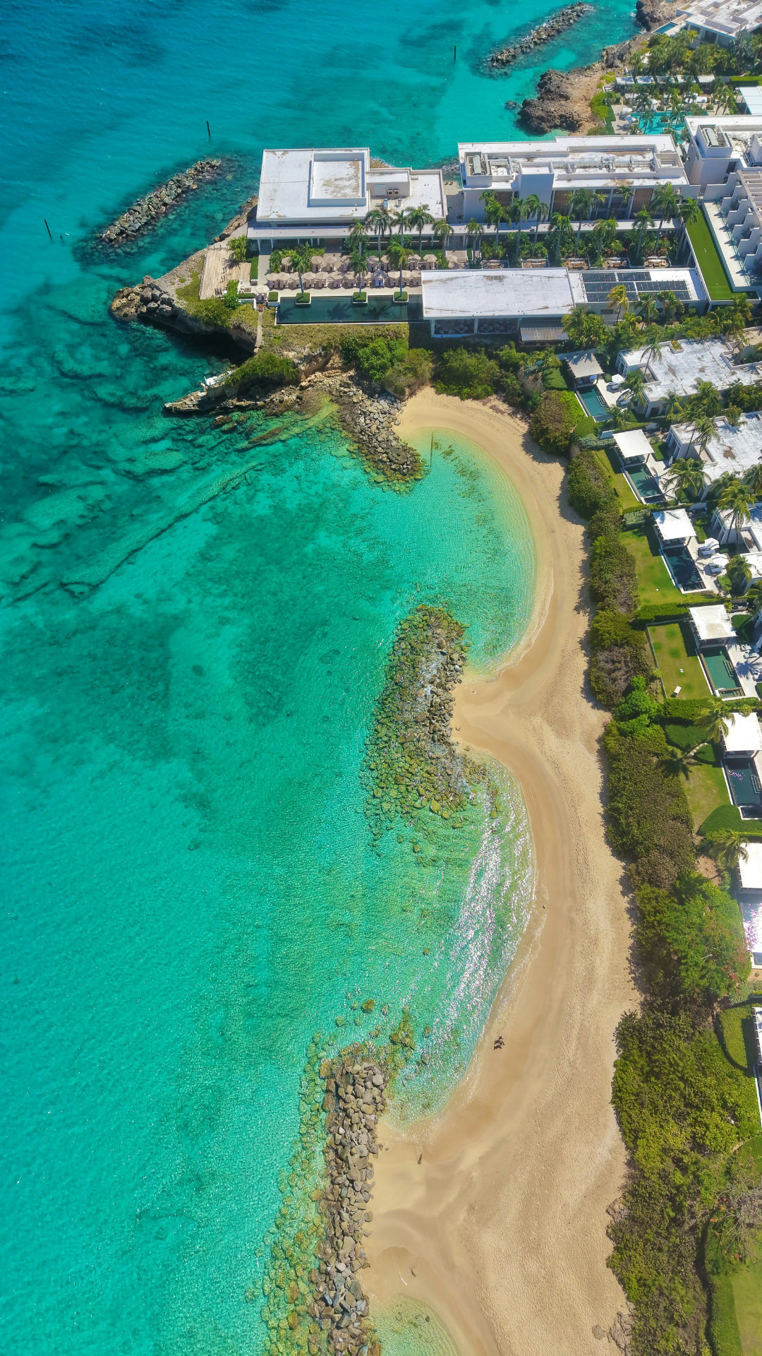 Aerial view of a coastal resort and turquoise beach